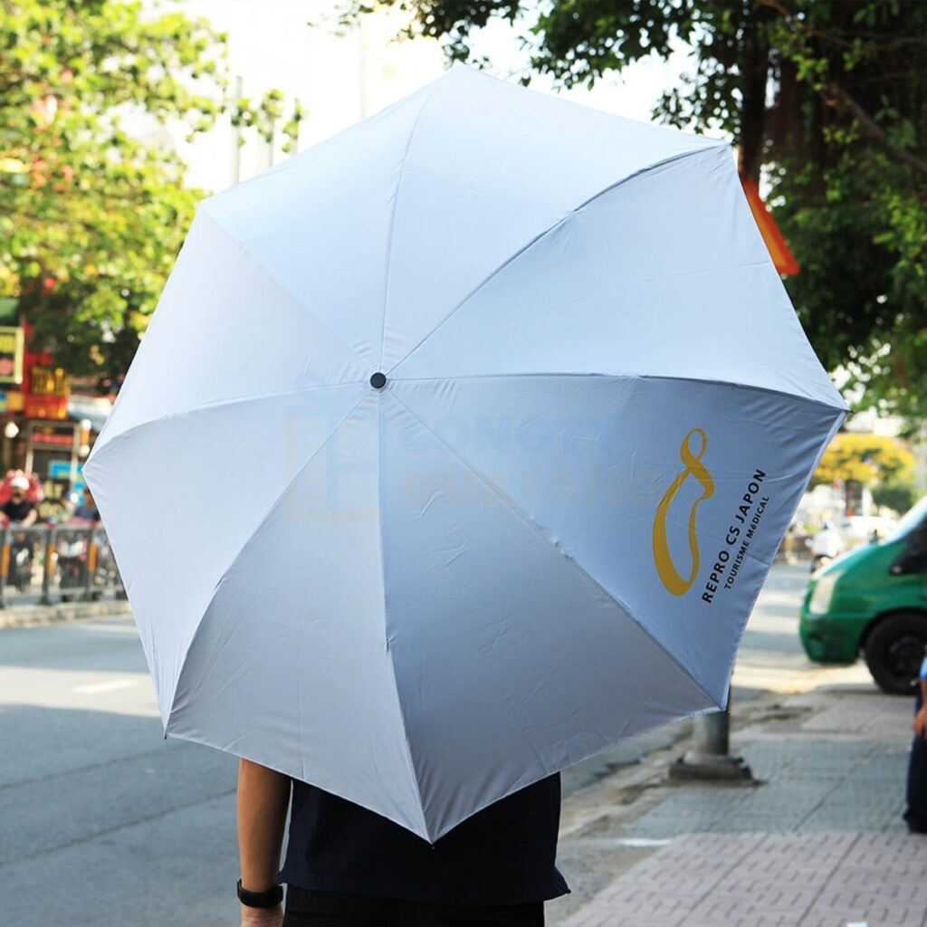 Ô dù cầm tay in ấn logo theo yêu cầu - Congtyquatang.com.vn