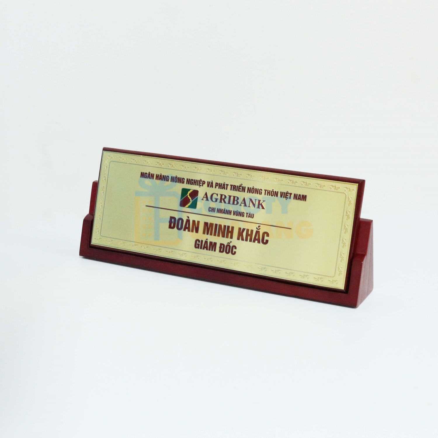 Desk nameplate makes the new title feel official while giving the workspace a confident executive presence